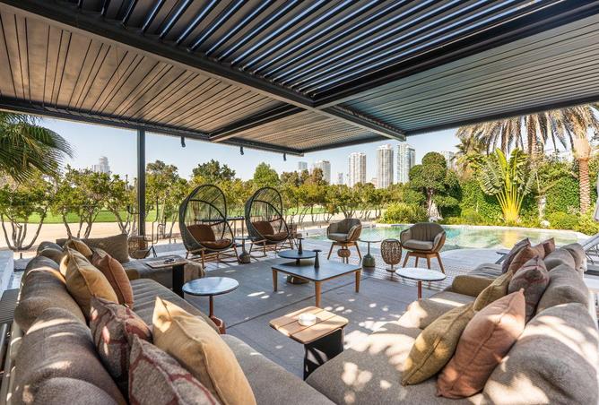 Covered terrace lounge overlooking the golf course